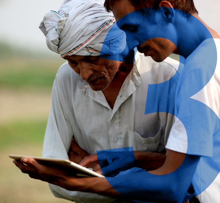 Two agriculturists using an e-tablet